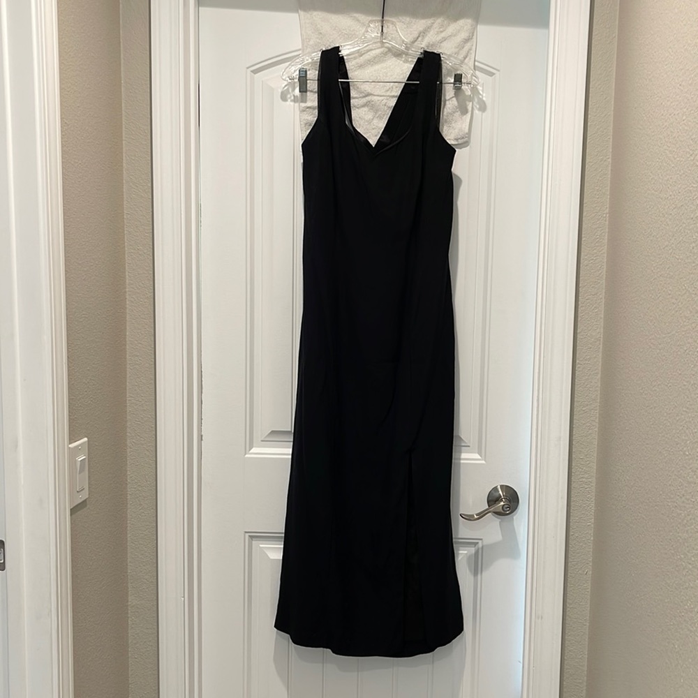 Long, ankle length black dress. Good condition. Cross cross back.